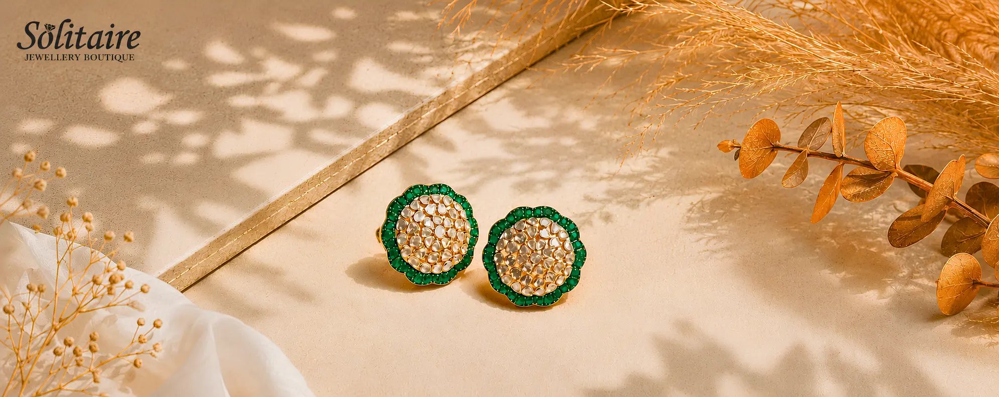 Emerald and gold stud earrings, handcrafted at Solitaire Jewellery Boutique